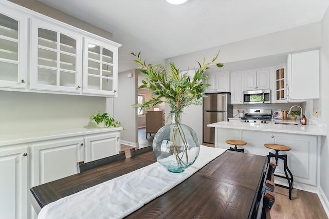 dining area featuring wood finished floors and baseboards