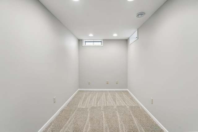 below grade area with carpet flooring, baseboards, and recessed lighting