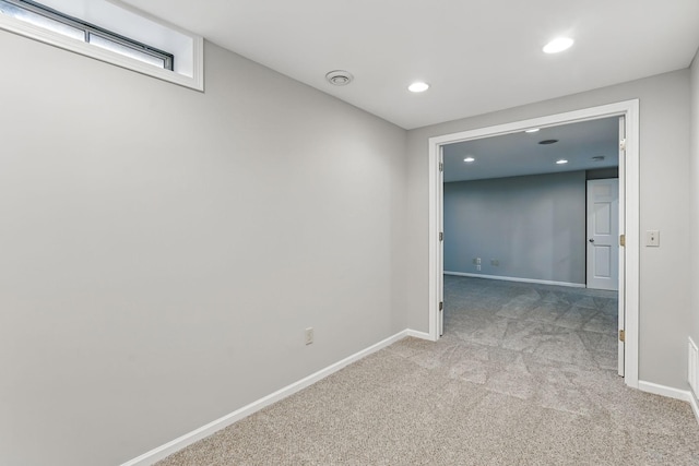 hall featuring recessed lighting, light colored carpet, and baseboards