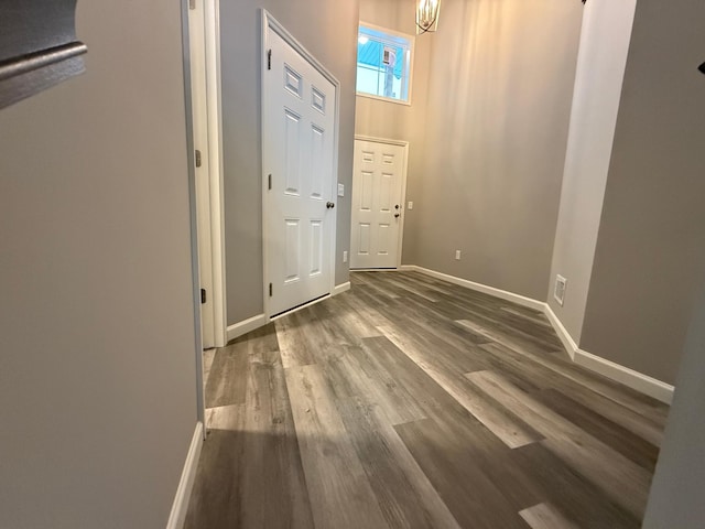 entrance foyer with wood finished floors and baseboards