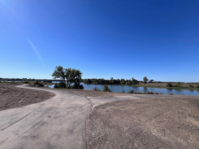 view of road featuring a water view