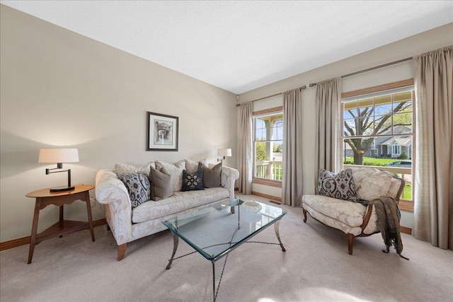 living room with light colored carpet and baseboards