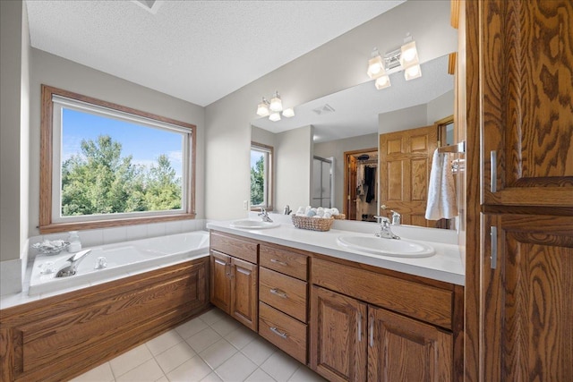 full bath with a bath, tile patterned floors, double vanity, and a stall shower