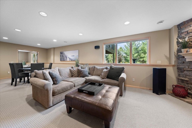 living room with light carpet, baseboards, and recessed lighting