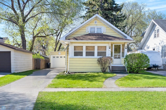 view of front of property featuring concrete driveway and roof with shingles