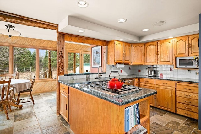 3213 Alger Grade, Silver Creek Twp, MN 55616 - kitchen featuring appliances with stainless steel finishes, a sink, tasteful backsplash, recessed lighting, and light stone finish floors