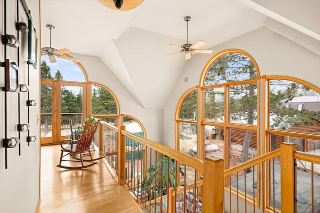 3213 Alger Grade, Silver Creek Twp, MN 55616 - hall with healthy amount of natural light, light wood-type flooring, an upstairs landing, and high vaulted ceiling