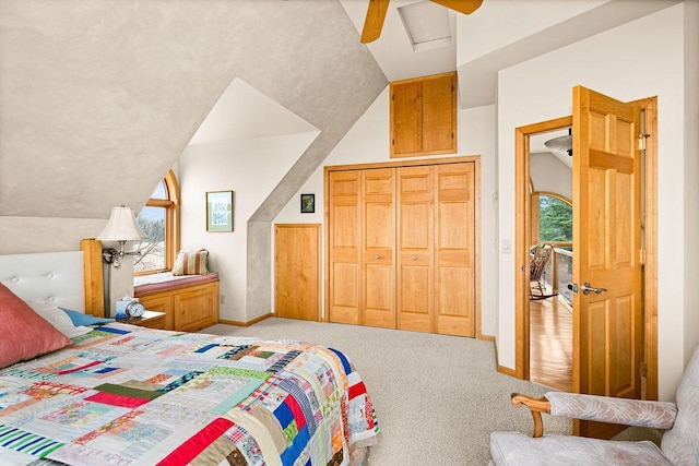 3213 Alger Grade, Silver Creek Twp, MN 55616 - carpeted bedroom featuring baseboards, vaulted ceiling, a ceiling fan, and a closet