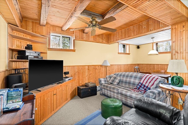 3213 Alger Grade, Silver Creek Twp, MN 55616 - living room with wood walls, carpet flooring, wood ceiling with exposed beams, plenty of natural light, and wainscoting