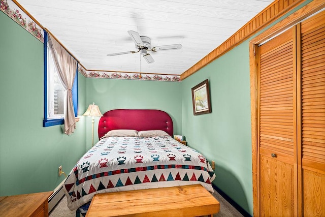 3213 Alger Grade, Silver Creek Twp, MN 55616 - bedroom with carpet, a closet, a ceiling fan, and a baseboard heating unit