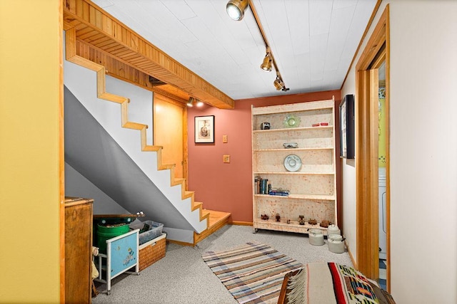 3213 Alger Grade, Silver Creek Twp, MN 55616 - hall featuring carpet, track lighting, stairway, and baseboards