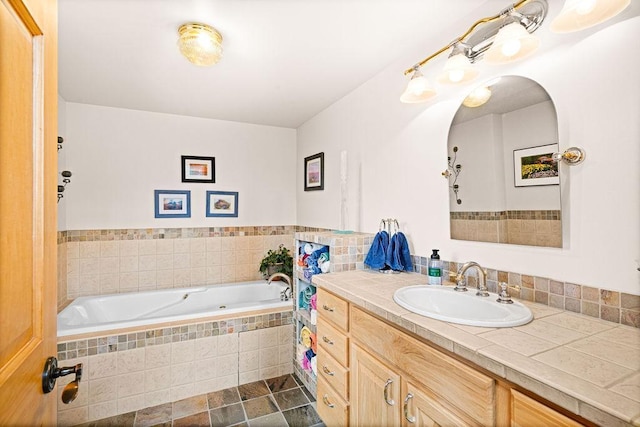 3213 Alger Grade, Silver Creek Twp, MN 55616 - bathroom featuring a relaxing tiled tub and vanity