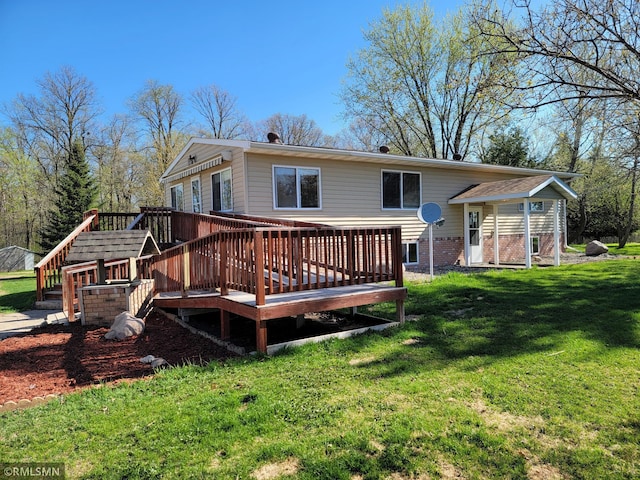 rear view of house with a wooden deck and a yard
