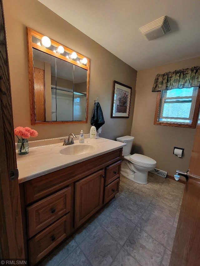 bathroom with vanity and toilet