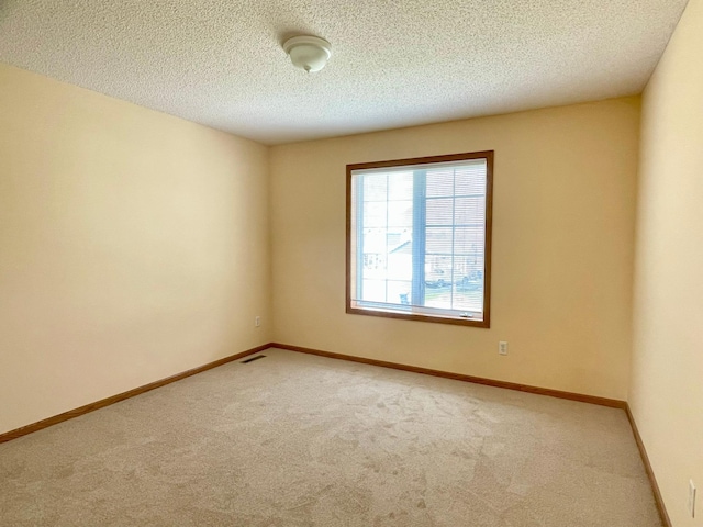 1986 Mathias Rd, Shakopee, MN 55379 - empty room featuring light colored carpet, a textured ceiling, and baseboards