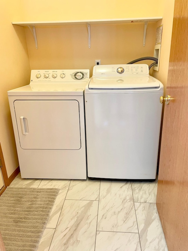 1986 Mathias Rd, Shakopee, MN 55379 - washroom with separate washer and dryer and light marble finish flooring