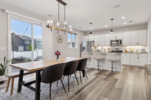 6813 5th St N, Brooklyn Center, MN 55430 - dining space featuring light wood finished floors and recessed lighting