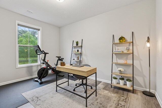 6813 5th St N, Brooklyn Center, MN 55430 - office area featuring baseboards and wood finished floors
