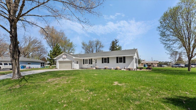 ranch-style house with concrete driveway, an attached garage, and a front lawn