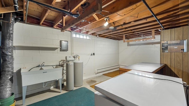 below grade area with a water softener, washing machine and clothes dryer, and a baseboard heating unit