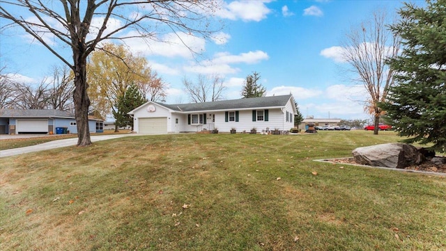 single story home with an attached garage, driveway, and a front yard
