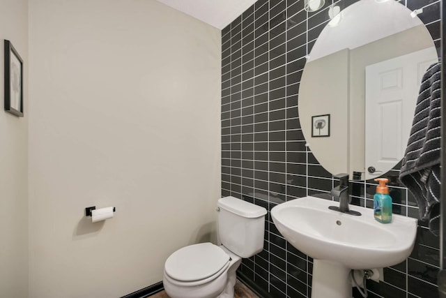 17208 72nd Ave N, Maple Grove, MN 55311 - bathroom with tile walls, toilet, and a sink