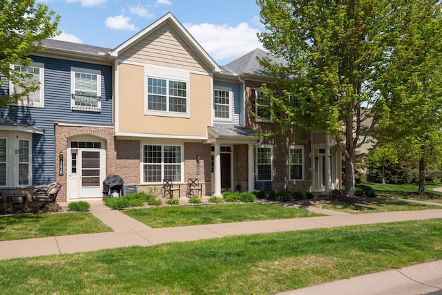 17208 72nd Ave N, Maple Grove, MN 55311 - view of property with a front yard and brick siding