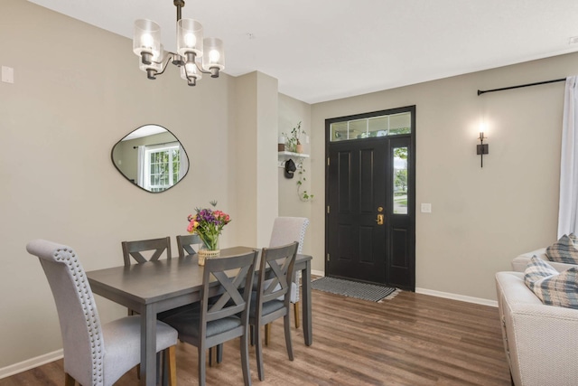 17208 72nd Ave N, Maple Grove, MN 55311 - dining space featuring a chandelier, wood finished floors, plenty of natural light, and baseboards