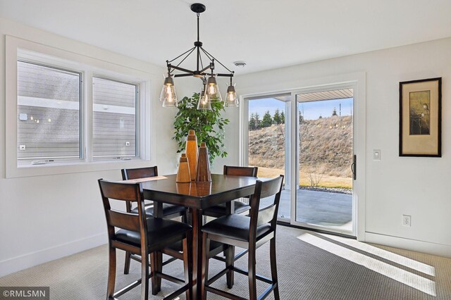 13708 Park Haven Trl, Prior Lake, MN 55372 - dining room featuring a chandelier, carpet, and baseboards