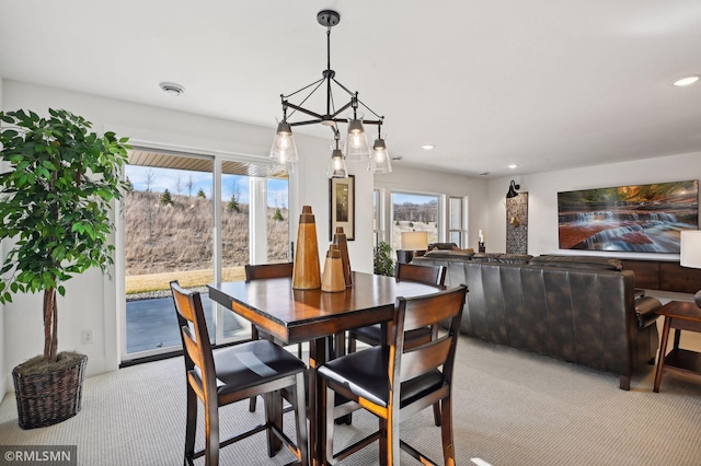 13708 Park Haven Trl, Prior Lake, MN 55372 - dining space with light colored carpet, recessed lighting, and a chandelier