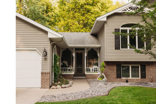 doorway to property with brick siding, roof with shingles, and an attached garage