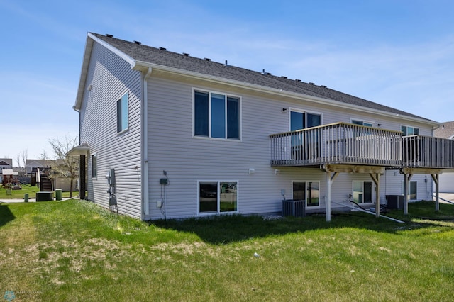 back of property featuring a yard, a wooden deck, and central air condition unit