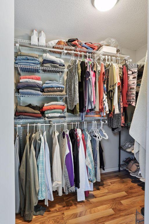 walk in closet featuring wood finished floors