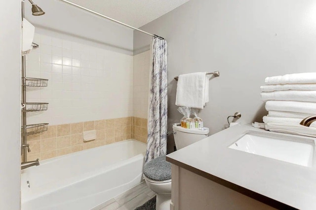 full bathroom with toilet, shower / tub combo, and vanity