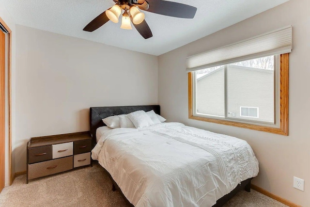 bedroom with carpet floors, baseboards, and ceiling fan