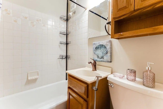 bathroom featuring toilet, shower / tub combination, and vanity