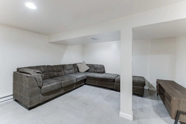 living room with baseboard heating and baseboards