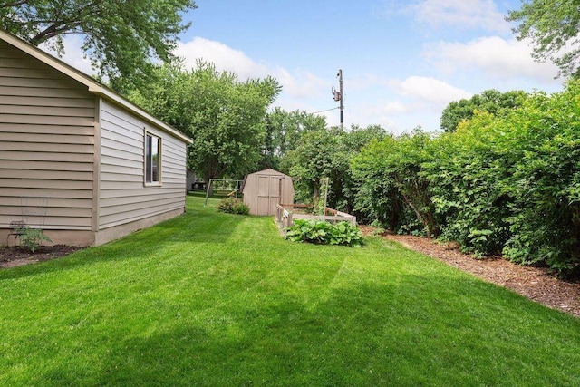 view of green lawn featuring a storage shed and an outdoor structure