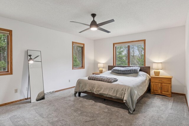 265 Red Pine Trl, Saint Joseph Twp, WI 54016 - bedroom with light carpet, baseboards, ceiling fan, and a textured ceiling