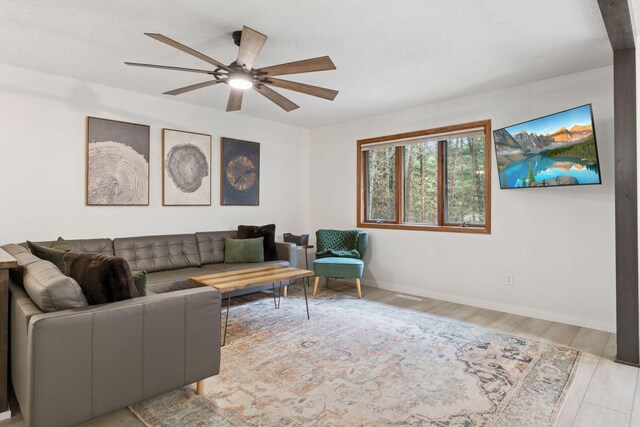 265 Red Pine Trl, Saint Joseph Twp, WI 54016 - living area featuring ceiling fan, wood finished floors, and baseboards