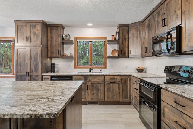 265 Red Pine Trl, Saint Joseph Twp, WI 54016 - kitchen featuring black appliances, open shelves, a sink, a textured ceiling, and tasteful backsplash