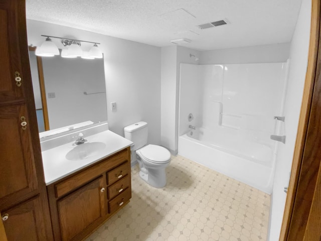 4984 Park Dr, Savage, MN 55378 - full bathroom featuring toilet, vanity, shower / tub combination, tile patterned floors, and a textured ceiling