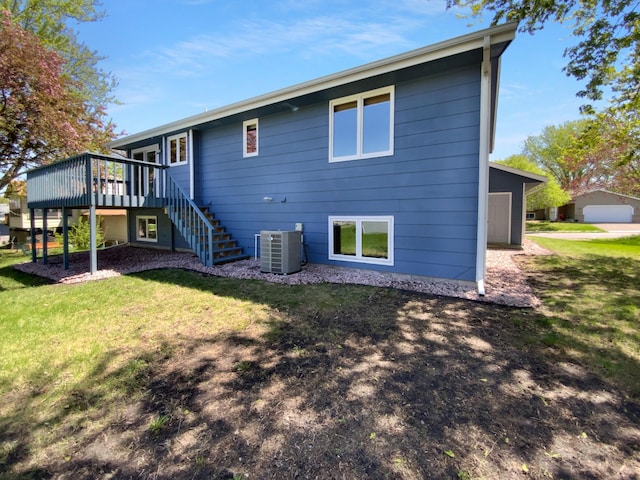 4984 Park Dr, Savage, MN 55378 - rear view of house with central AC, stairway, a deck, and a lawn