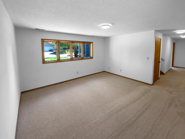 4984 Park Dr, Savage, MN 55378 - empty room with light carpet, a textured ceiling, and baseboards