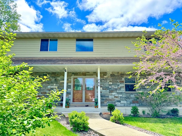 766 County Road F E, Vadnais Heights, MN 55127 - view of front facade featuring covered porch and stone siding