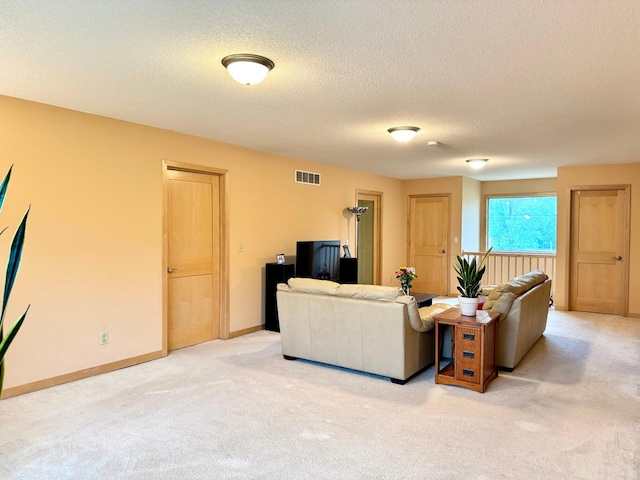 766 County Road F E, Vadnais Heights, MN 55127 - living area featuring light colored carpet, a textured ceiling, and baseboards