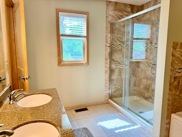 766 County Road F E, Vadnais Heights, MN 55127 - full bath with a shower stall, tile patterned flooring, baseboards, and double vanity