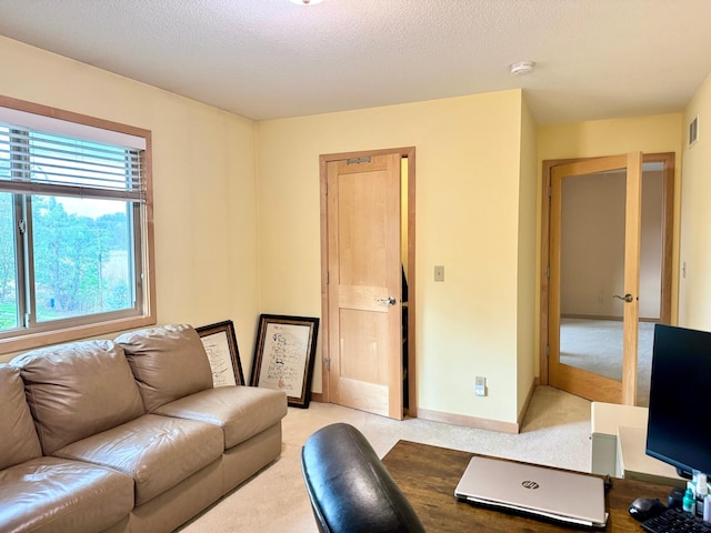 766 County Road F E, Vadnais Heights, MN 55127 - living room with light colored carpet, a textured ceiling, and baseboards