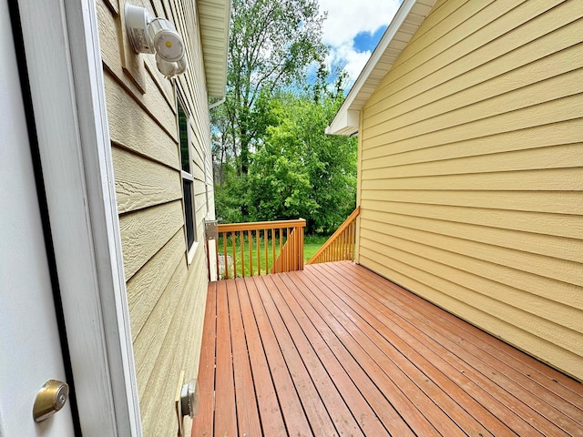 766 County Road F E, Vadnais Heights, MN 55127 - wooden deck featuring view of wooded area