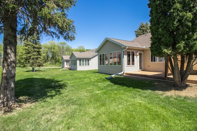 1922 Eastridge Ct, Stillwater, MN 55082 - back of house featuring a yard, roof with shingles, and a wooden deck